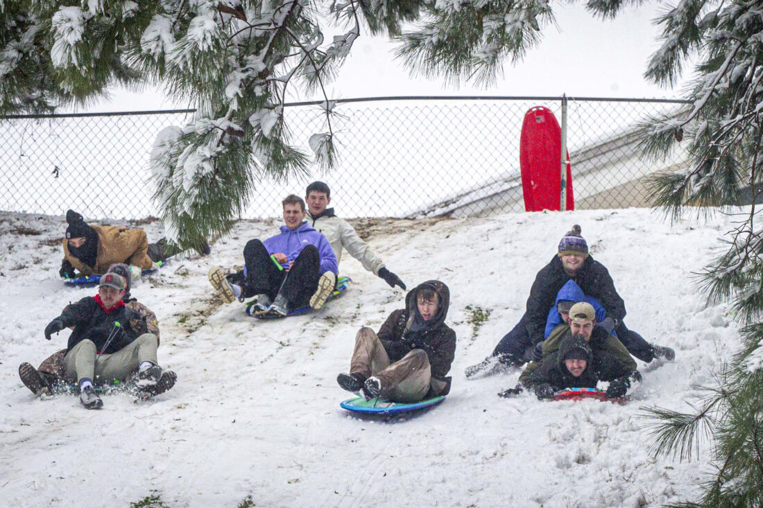 Powerful winter storm dumps heavy snow, causing flight delays, slick ...